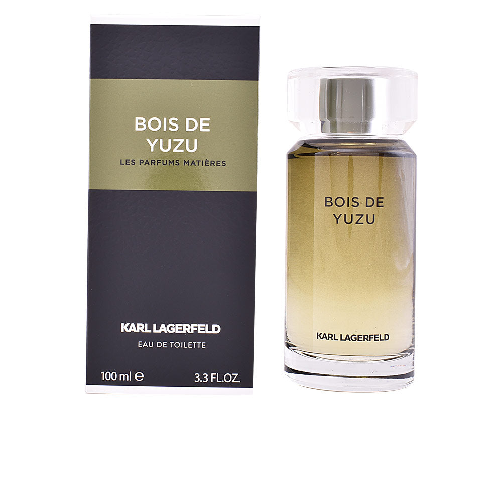 Cylindrical olive‑green glass bottle of Yuzu Wood Eau de Toilette, 100 ml