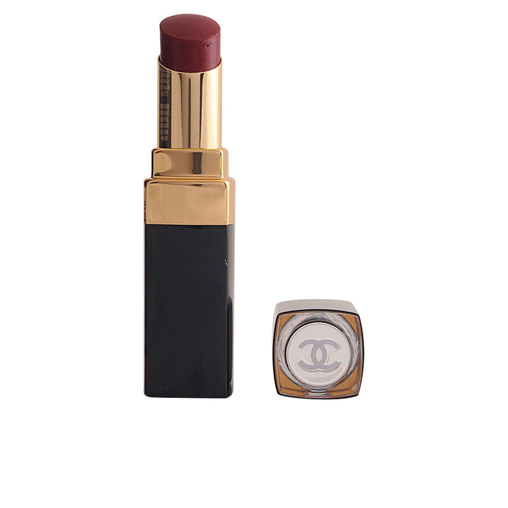 Compact high-shine hydrating lipstick in warm brown shade, reflective finish