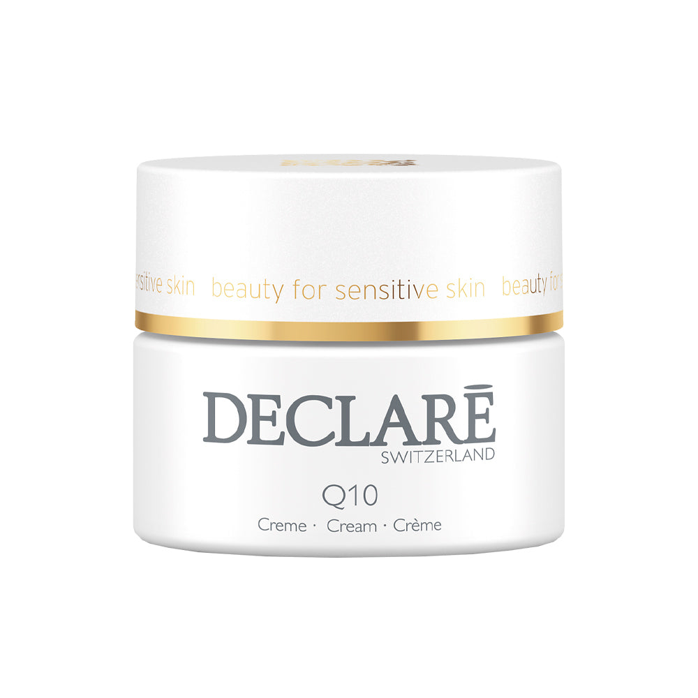 Declaré Cream-filled jar with smooth white balm, labeled Q10 anti-aging, simple modern jar design