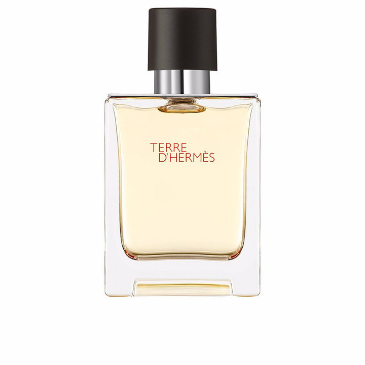 Rectangular glass bottle with metal shoulders; 100 ml woody-citrus perfume for Man