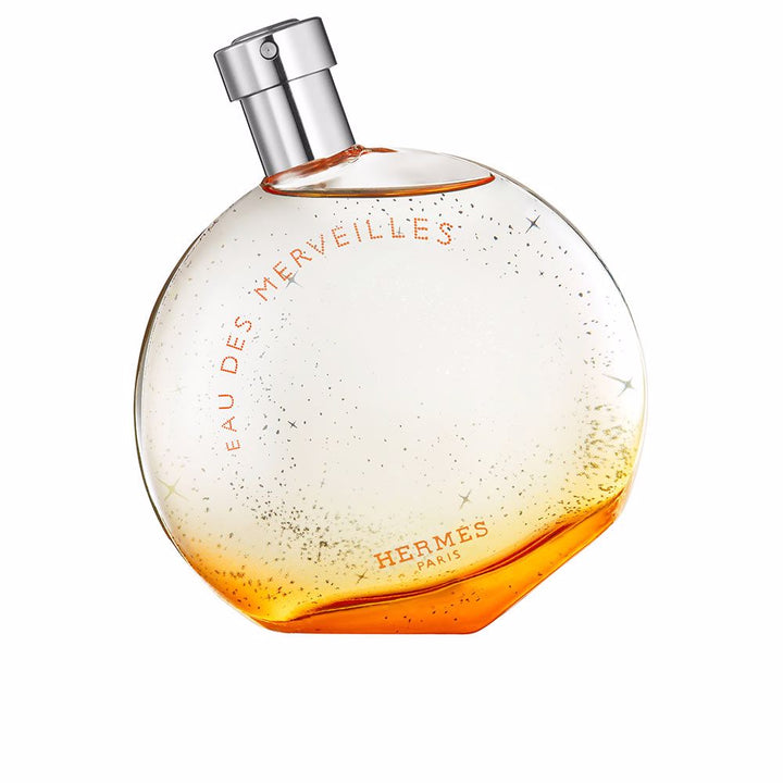 Rounded glass bottle of amber-hued eau de parfum, 50 ml, woody amber notes