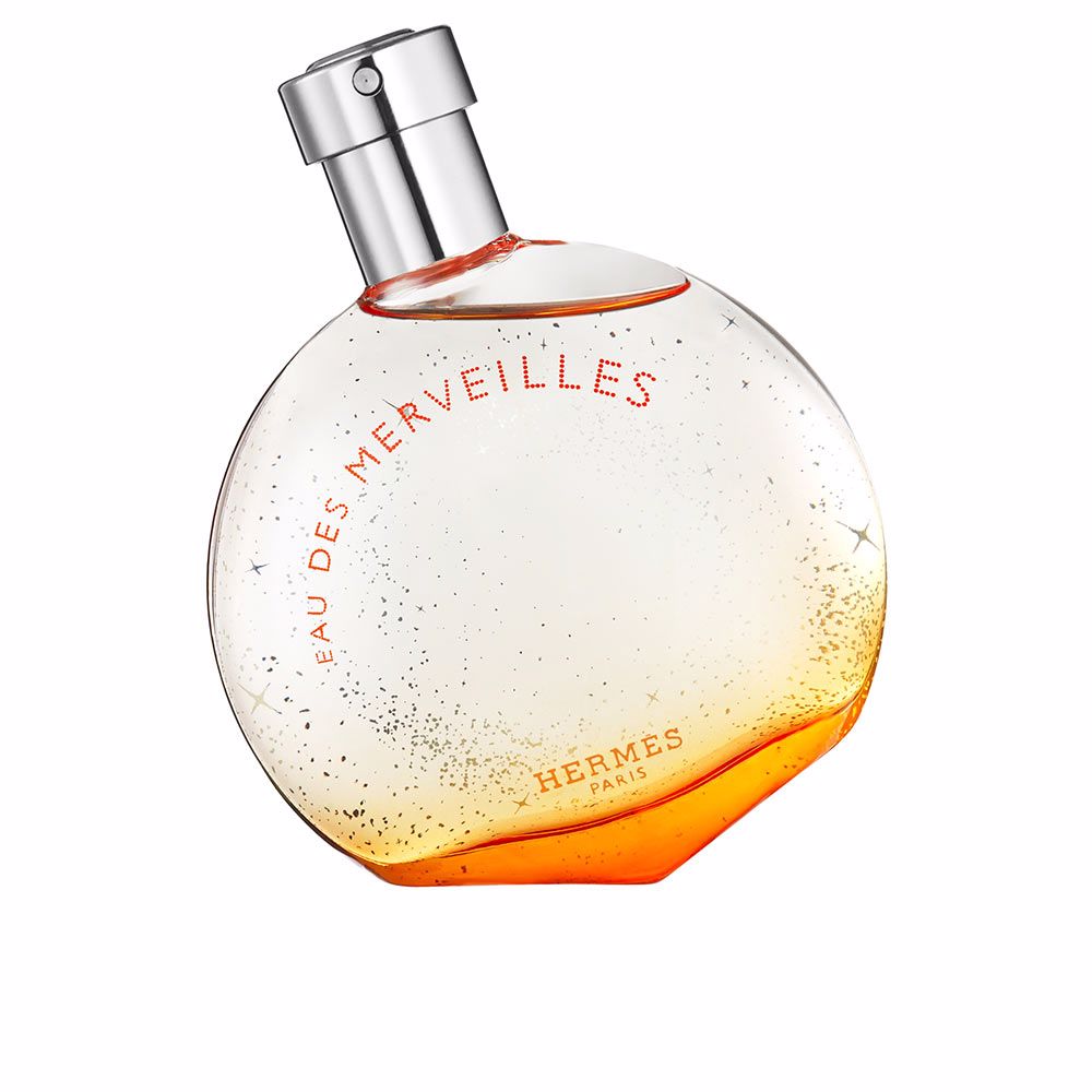 Rounded glass bottle of amber-hued eau de parfum, 50 ml, woody amber notes