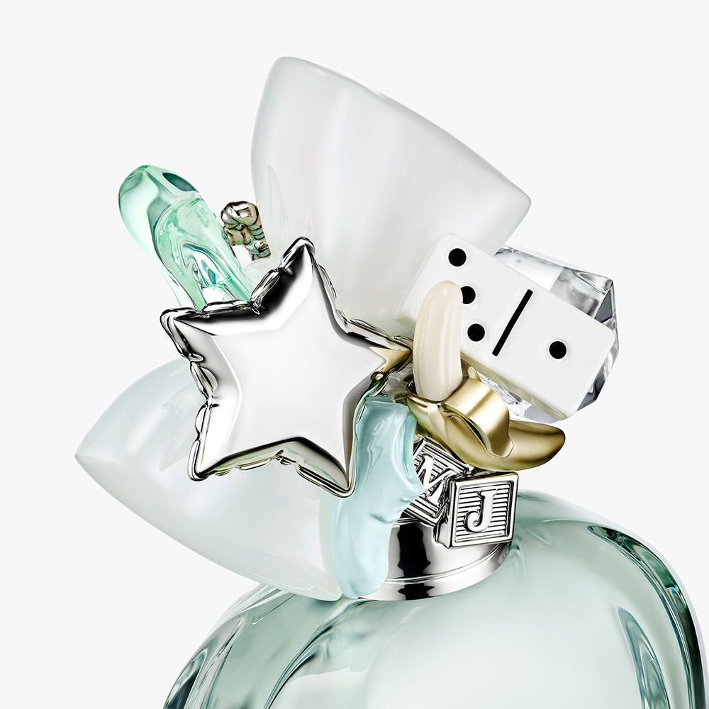 Faceted clear 50 ml eau de toilette bottle with silver cap and small bow