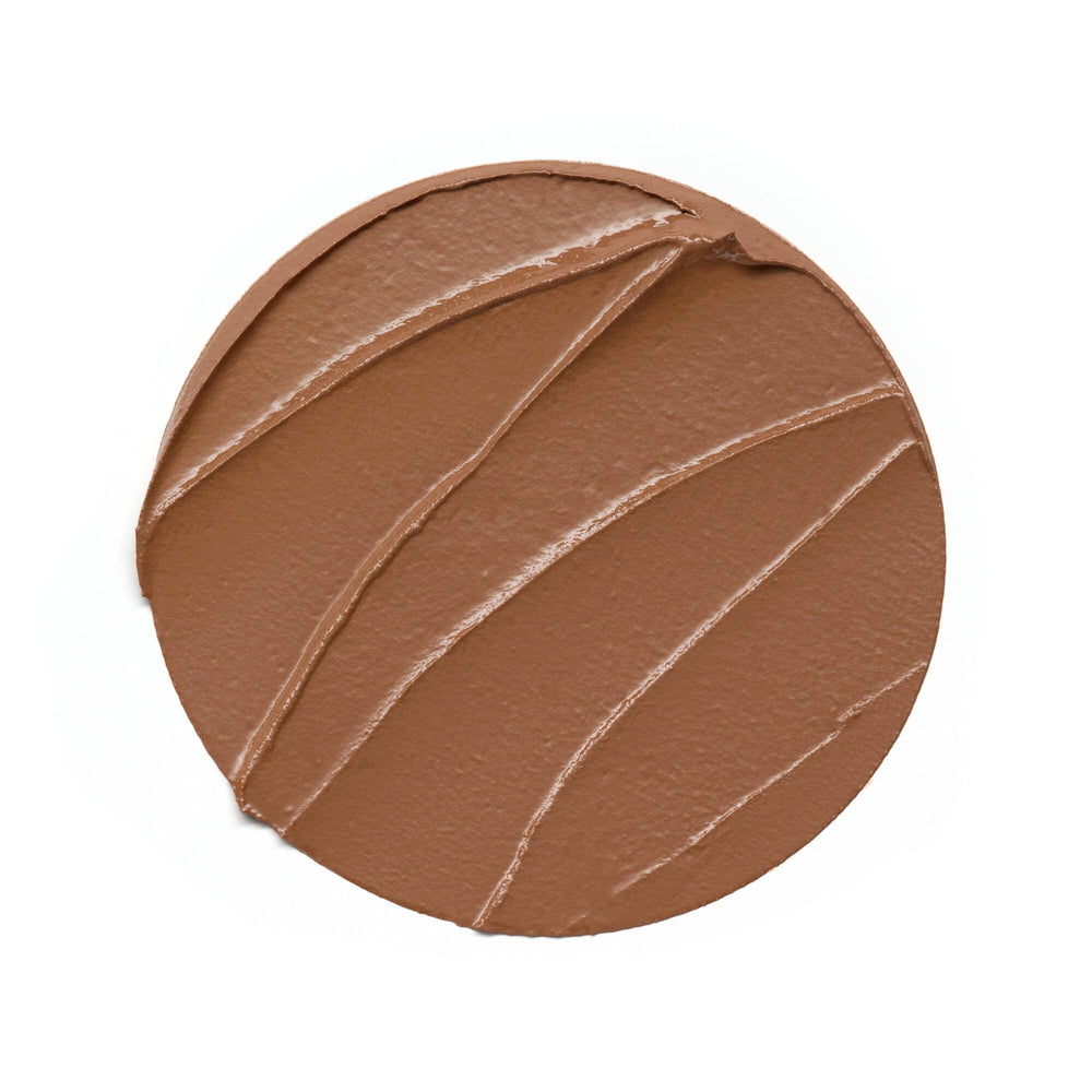 Cream bronzer stick in compact tube, warm tan shade, 5.5 g