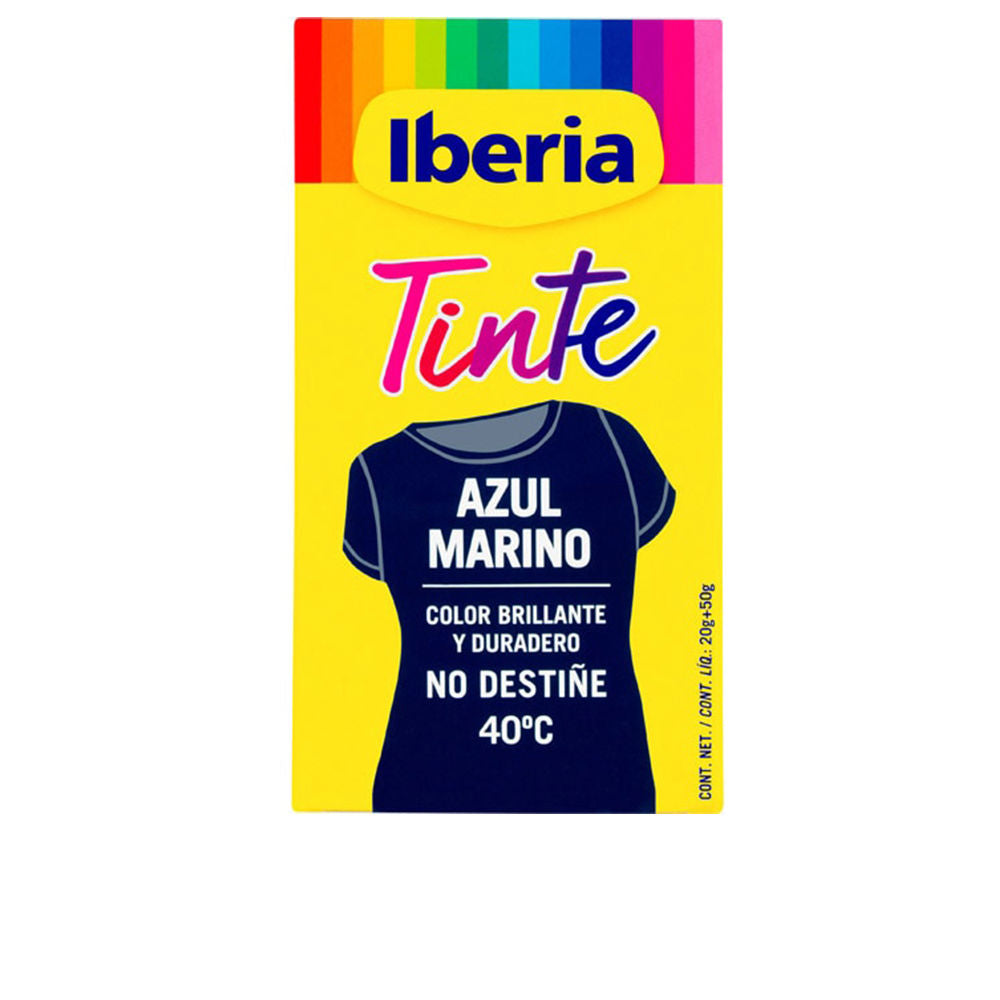 Iberia Bottle of deep navy textile dye beside a matching dyed fabric swatch and clear measuring cup