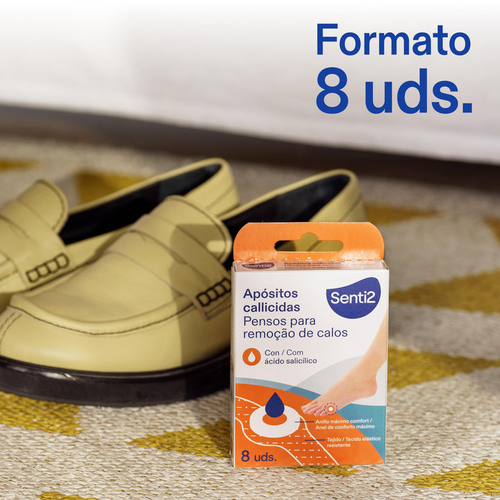 Senti2 rectangular white, orange, and blue box of corn removal pads showing foot illustration, drop icon, multilingual text, and top cut-out handle.