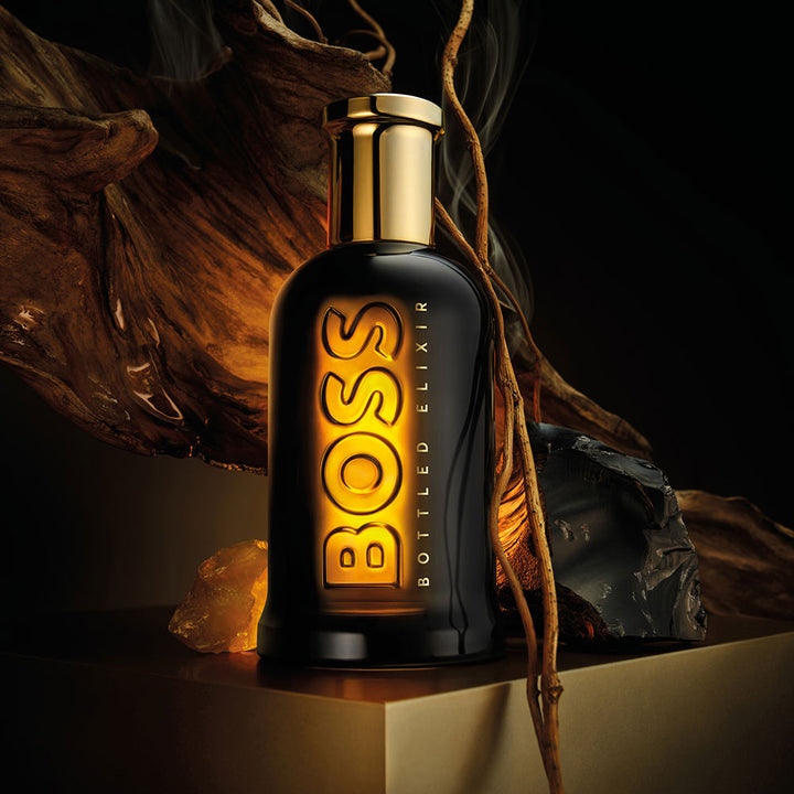 Glossy black glass parfum bottle with brushed gold cap, 100 ml vial