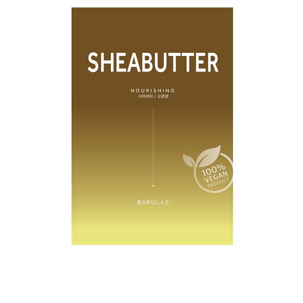 Small pot of creamy shea face mask with botanical extract ingredients on surface