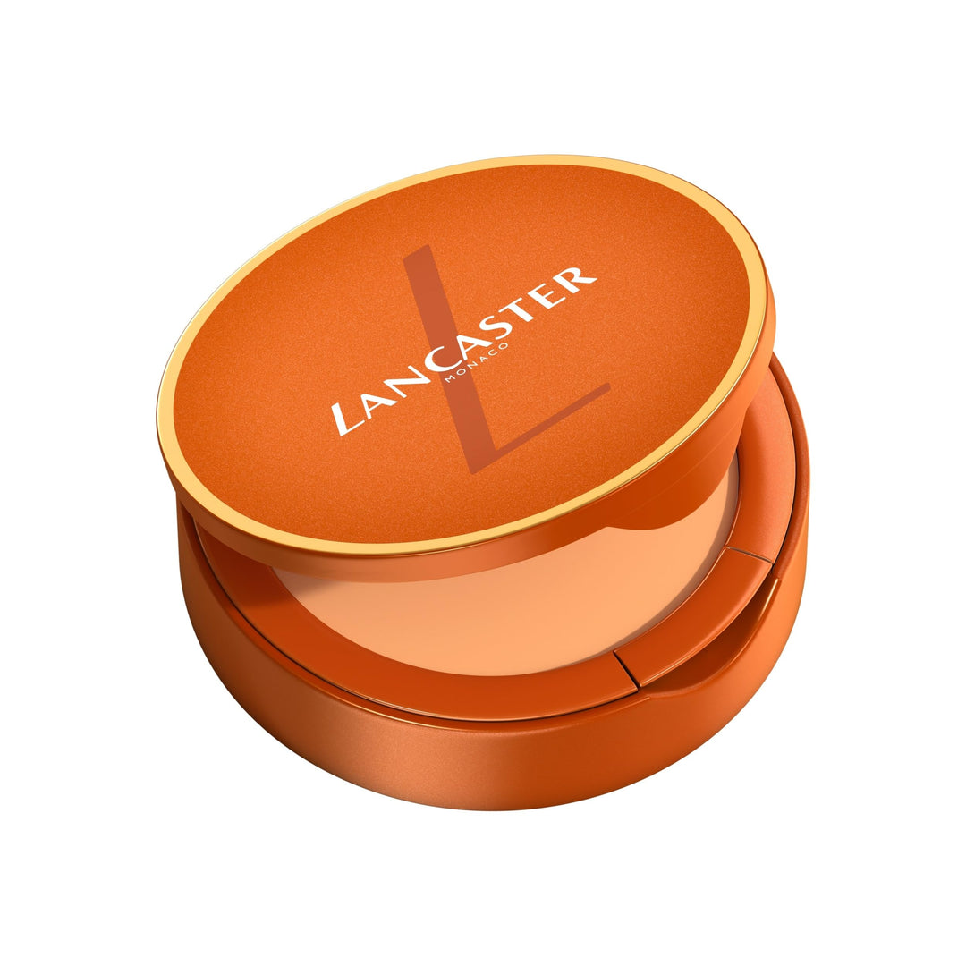 Compact tinted sun cream SPF50 in pressed pan with sponge applicator, 9 g