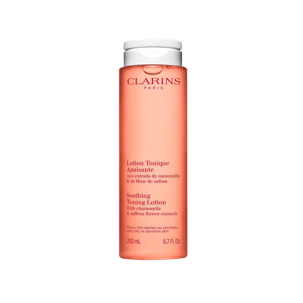 Transparent orange plastic toning lotion bottle with flip-top cap, minimalist design, Clarins label visible