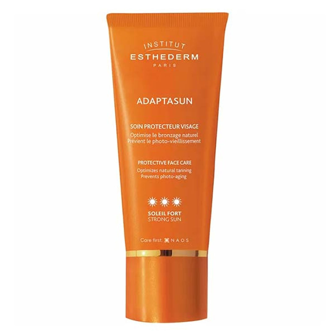 Institut Esthederm Creamy sunscreen bottle with tan-enhancing formulation, sleek cylindrical tube and minimalist label design