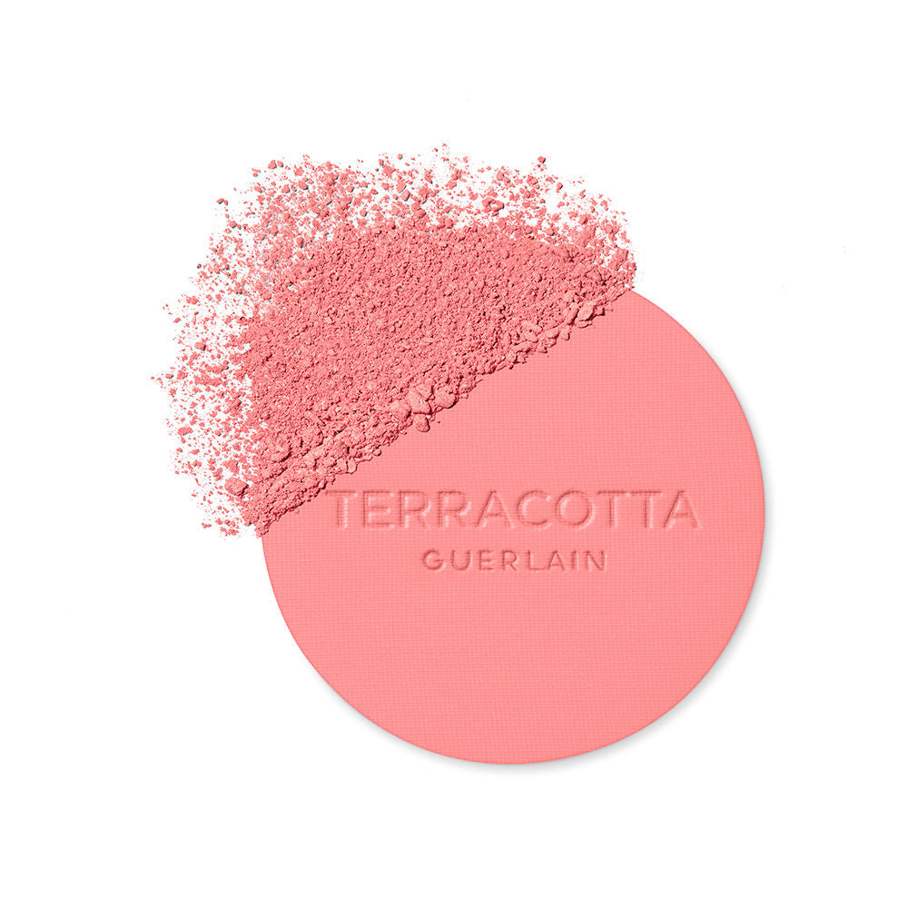 Guerlain Round glossy-lidded plastic compact showing pressed pink and brown powder blush, refined craftsmanship .