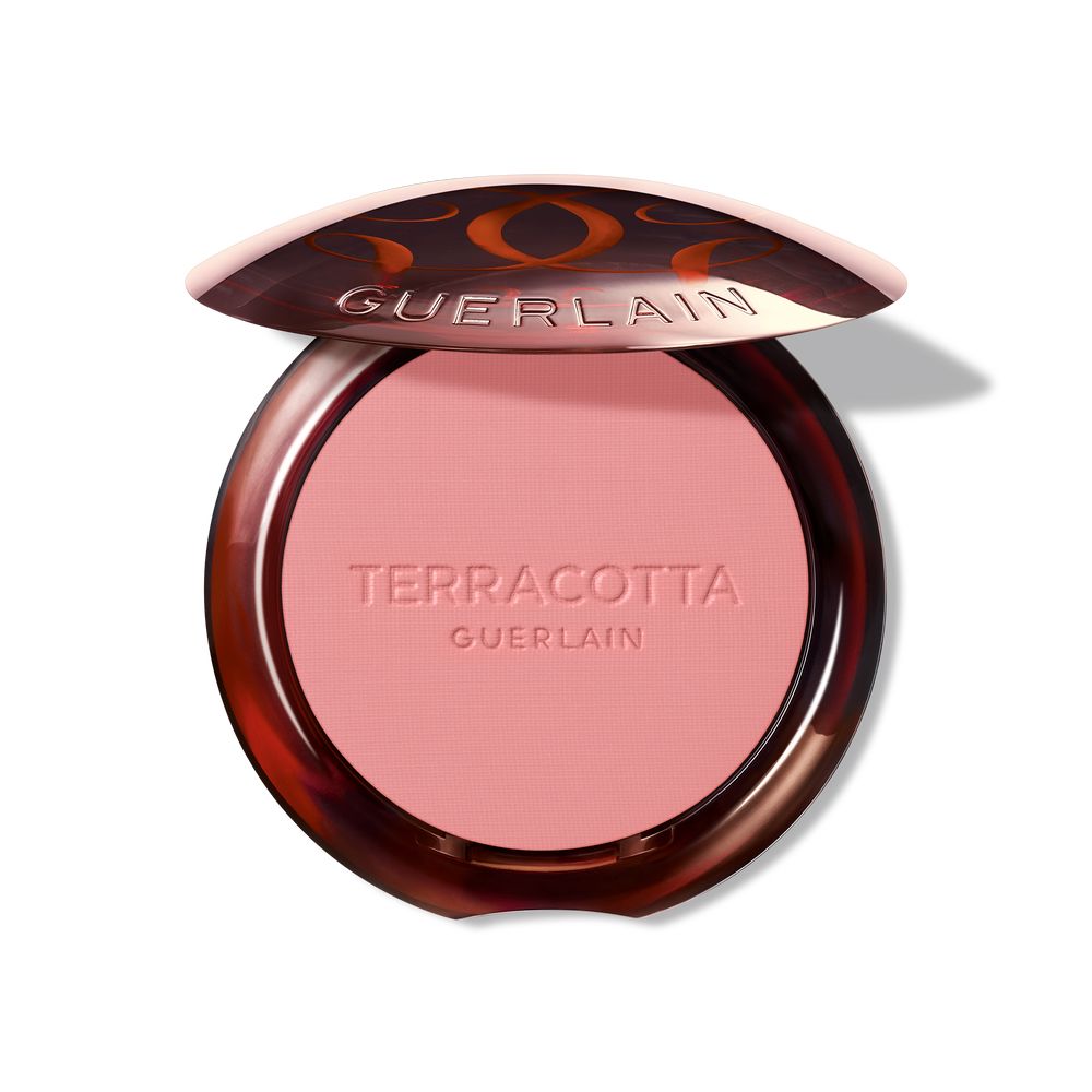 Guerlain Round glossy-lidded plastic compact showing pressed pink and brown powder blush, refined craftsmanship .