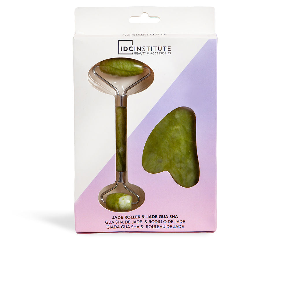 Green jade roller and gua sha stone with metal frame and white and purple accents, IDC Institute
