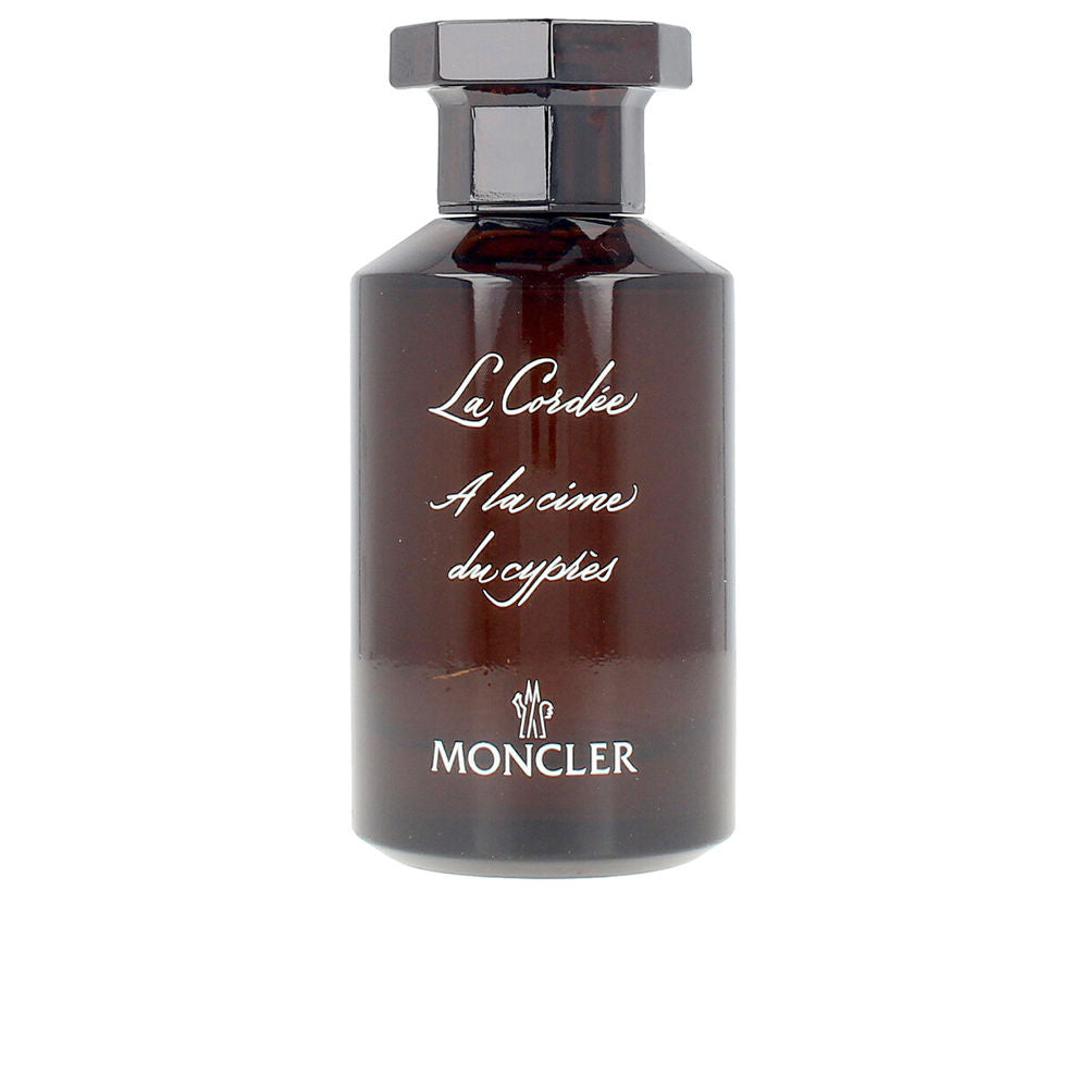 Apothecary-style 100 ml eau de parfum bottle; dark textured paper packaging, woody-citrus fragrance