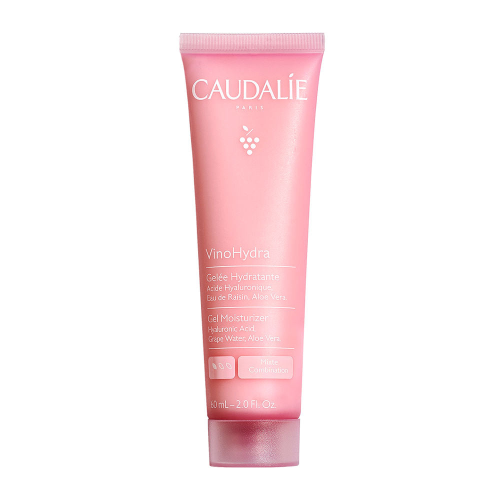 Caudalie-branded white, blue, and yellow plastic toothpaste tube with flip-top cap, simple packaging