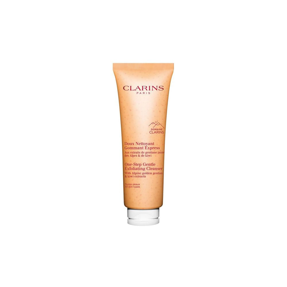 Peach-orange plastic tube with flip-top cap, visible small exfoliating beads, printed front logo Clarins