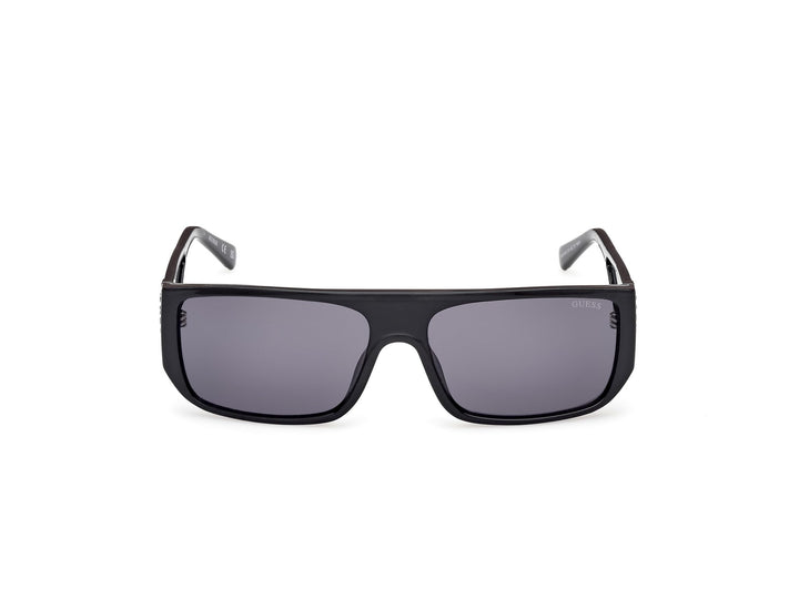 Guess rectangular black plastic sunglasses with thick frame, dark tinted lenses, straight temples, lens logo