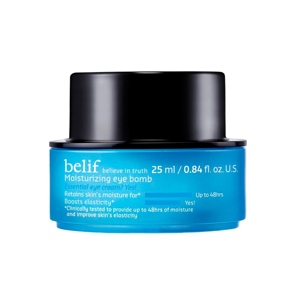 Tube of Belif moisturizing eye cream beside fragrant botanicals on white surface