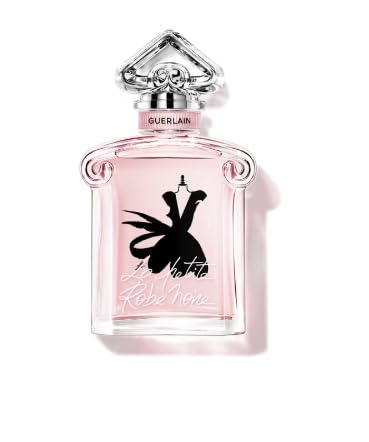 Delicate pink inverted-heart glass perfume bottle with black cap, Guerlain label centered on neutral background