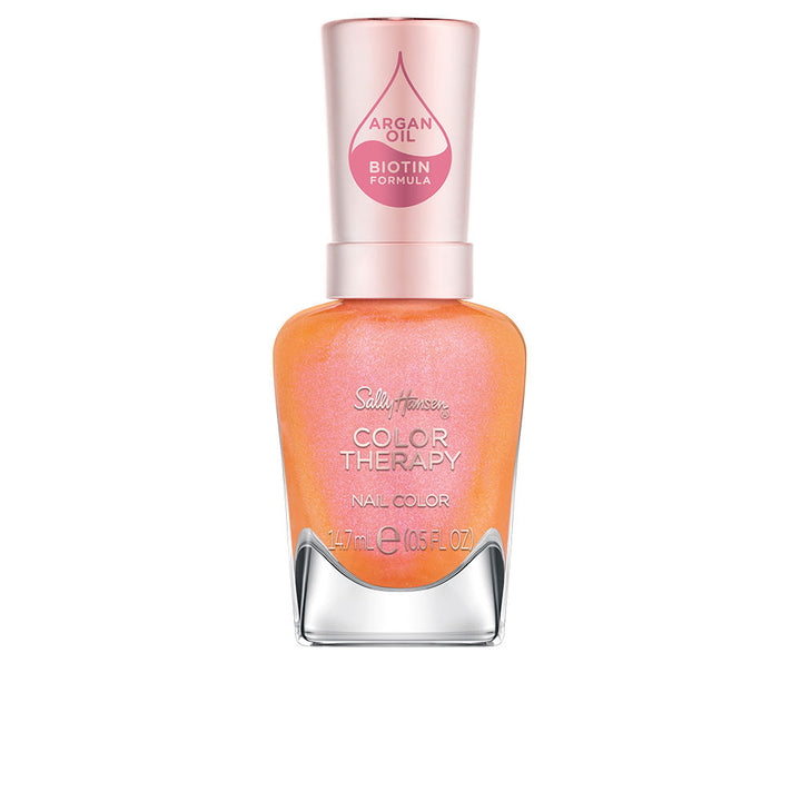 Bottle of tangerine nail lacquer, 14.7 ml, glossy finish, argan oil formula