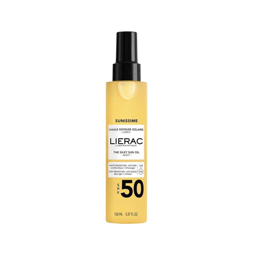 Lierac Silky sun oil bottle labeled SPF50 with satin finish, golden liquid visible through clear glass