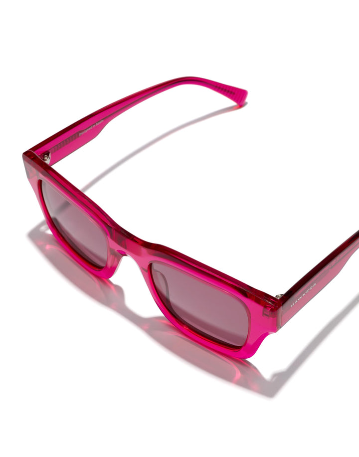 Hawkers Pink transparent plastic square sunglasses with thick frame, rectangular lenses and dark tinted lenses