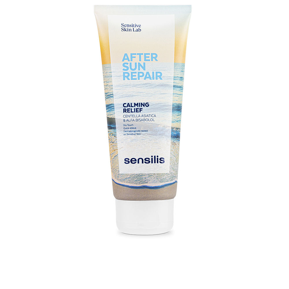 Sensilis Minimalist plastic tube with white cap, blue and beige beach imagery, labeled after-sun repair gel