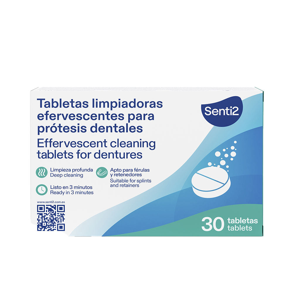 Senti2 effervescent tablet dissolving in water beside a dental appliance