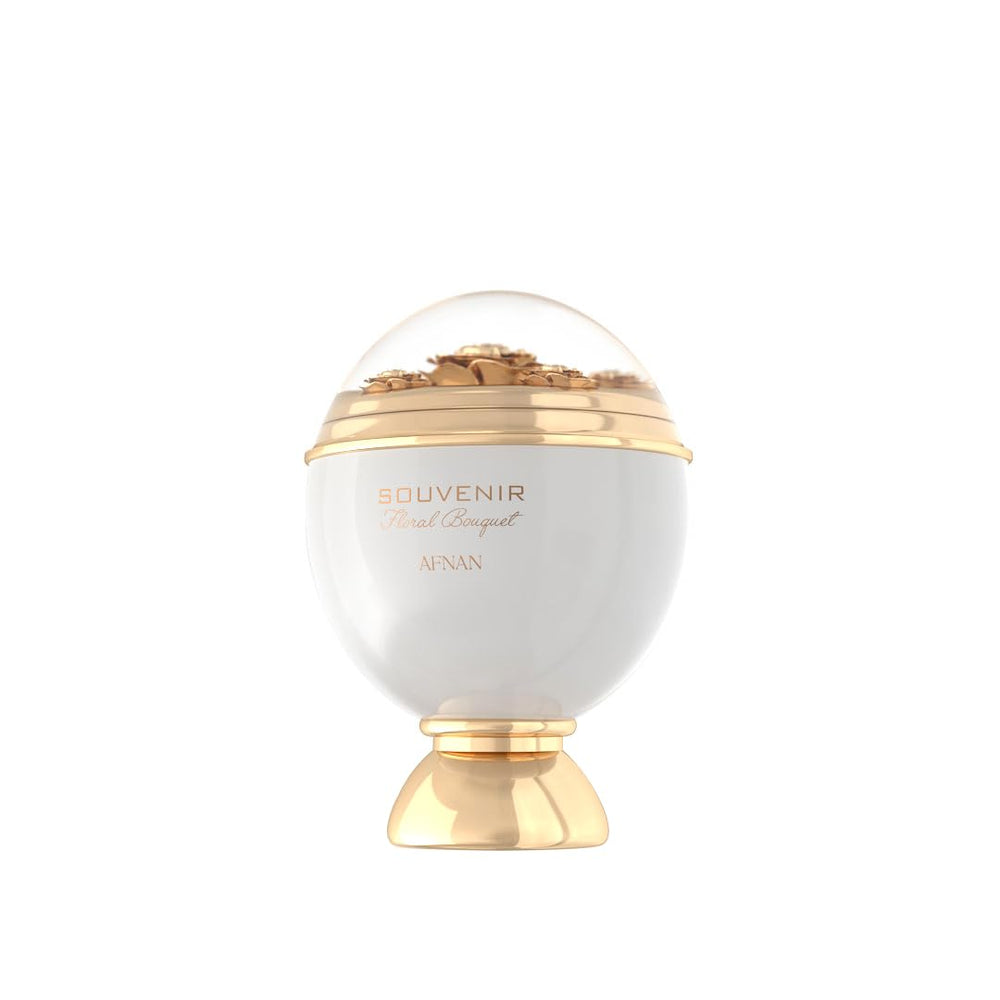 White dome perfume bottle with gold decorative base and floral detail under transparent top, Afnan.
