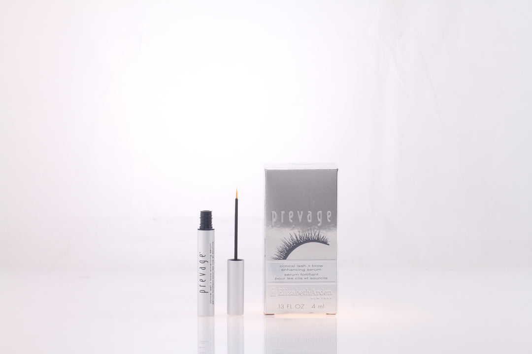 Elizabeth Arden Silver cylindrical serum tube with thin brush applicator, printed text and reflective box featuring eyelash graphic