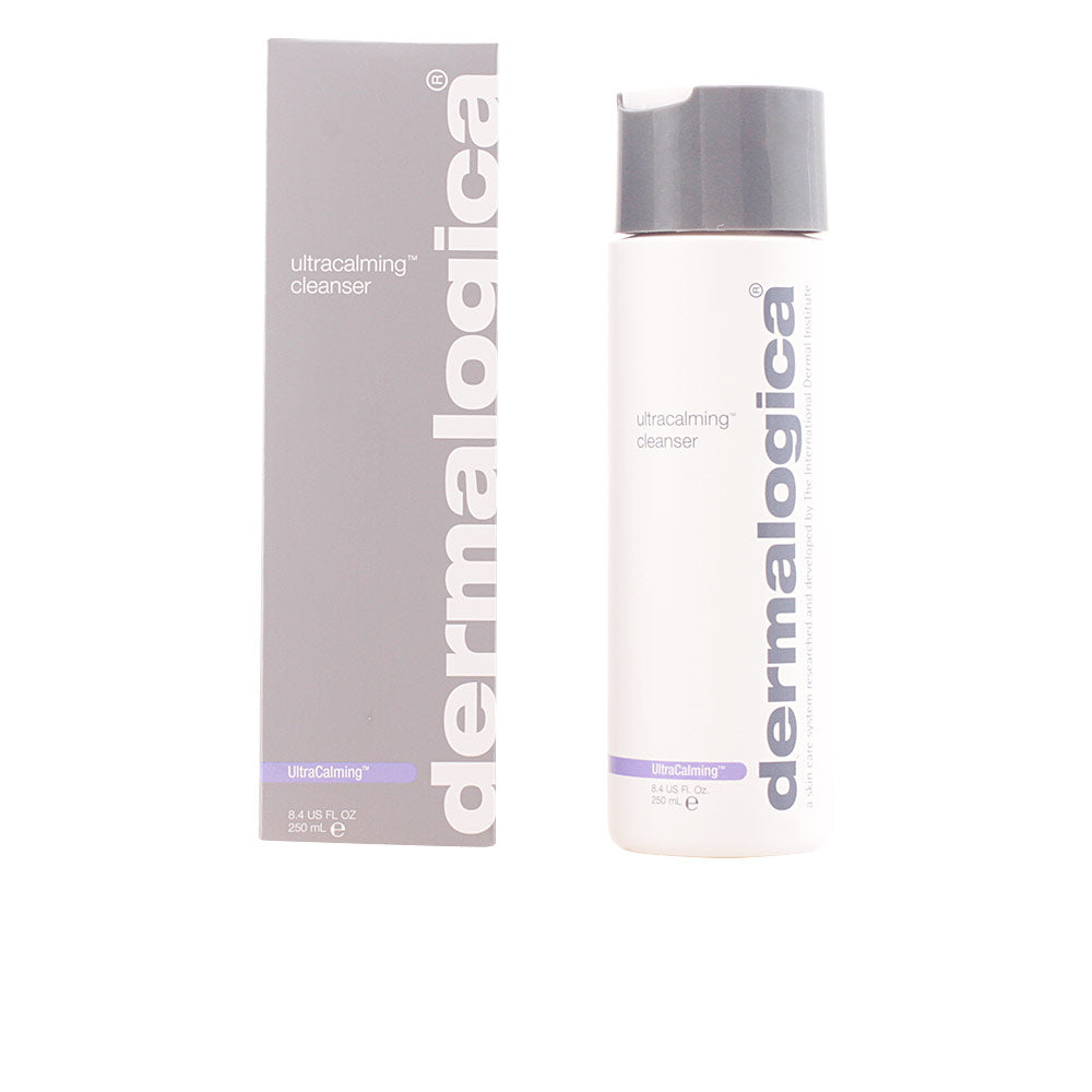 Minimalist white plastic cleanser bottle with flip cap, rectangular gray box, purple accent strip, Dermalogica