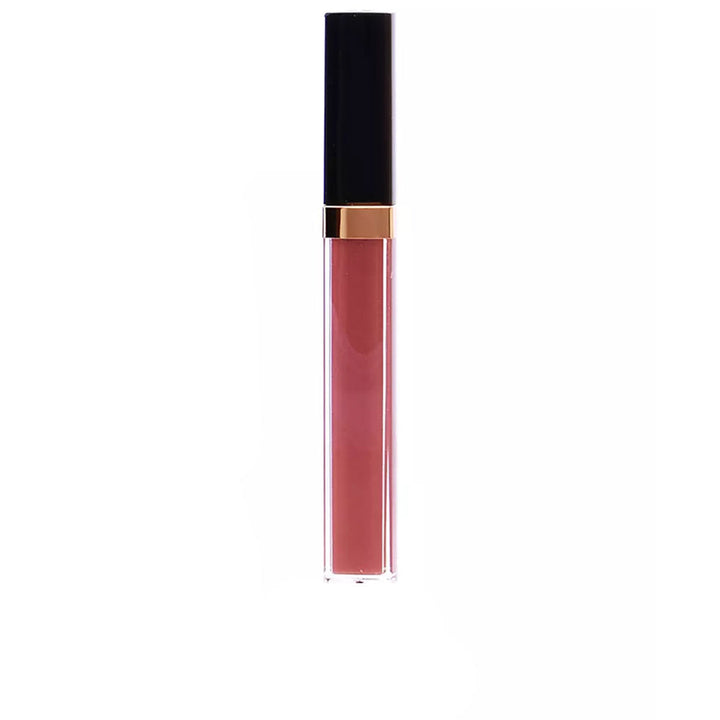 Chanel Pink lip gloss in transparent cylindrical plastic tube with black-and-gold screw cap