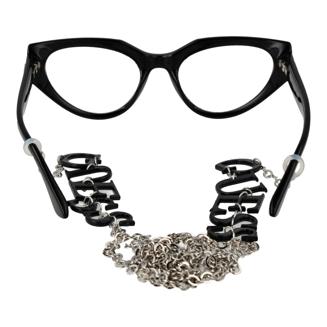 Black cat-eye eyeglasses with plastic frame and metal lettered chain draped against neutral background
