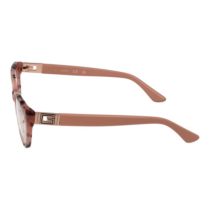 Pink tortoiseshell cat-eye eyeglasses in plastic with decorative metal logos on temples, angled view