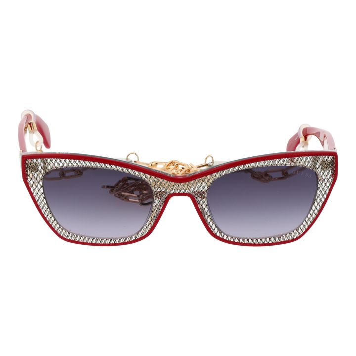 Red and black textured cat-eye sunglasses with gradient grey lenses and decorative gold chain over a neutral background