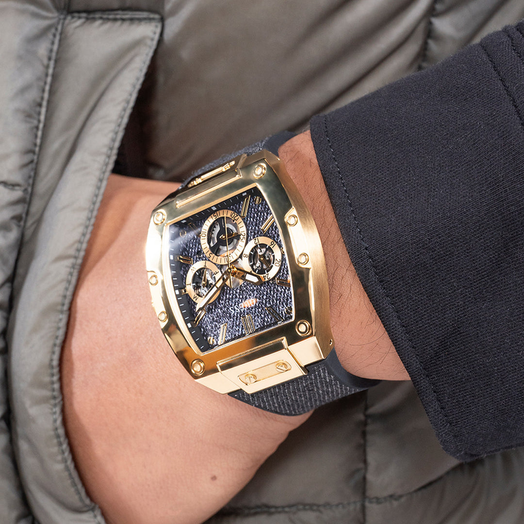 Gold and black chronograph watch with fabric-textured strap and three subdials, Unisex design