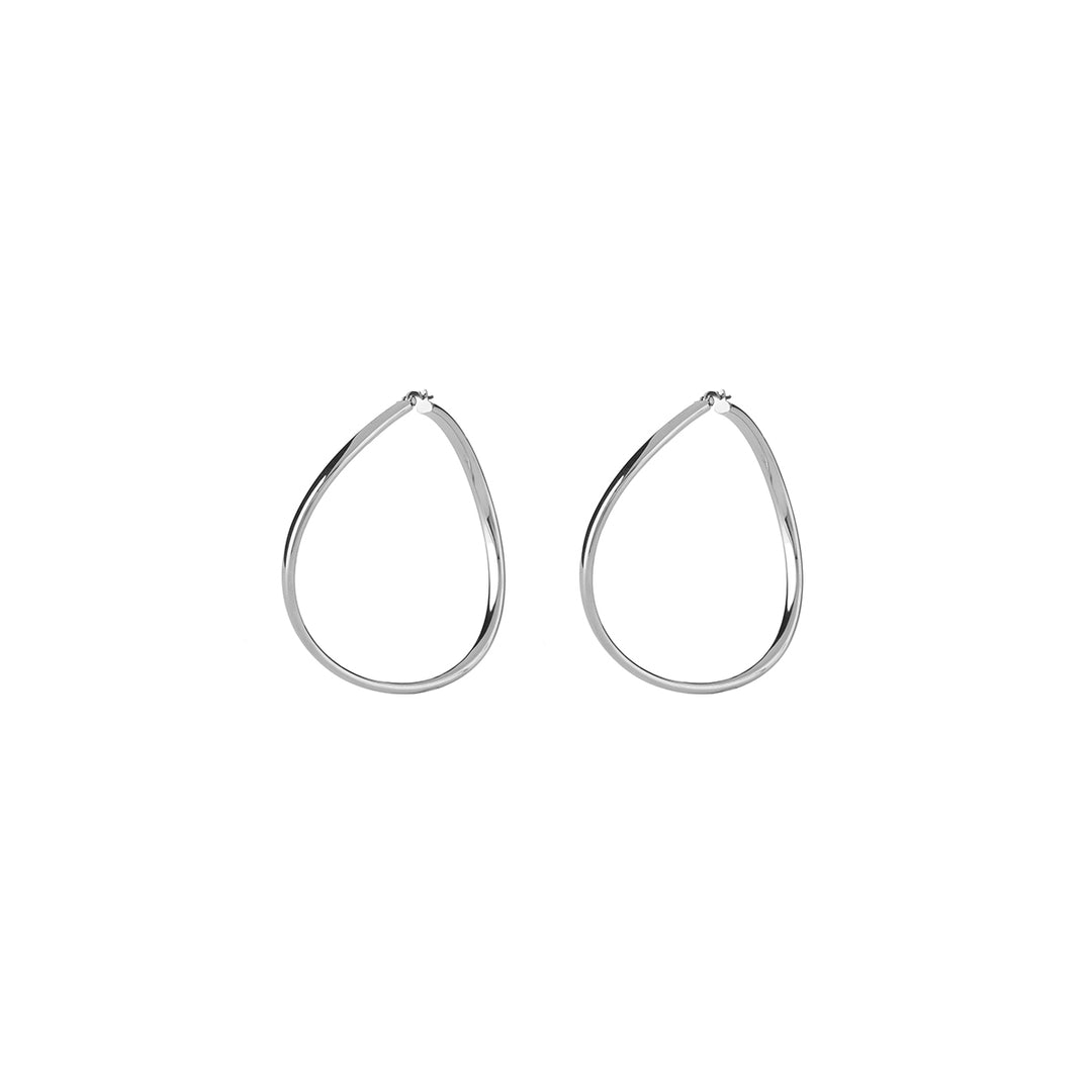 Polished silver teardrop hoop earrings in minimalist metal design on neutral background