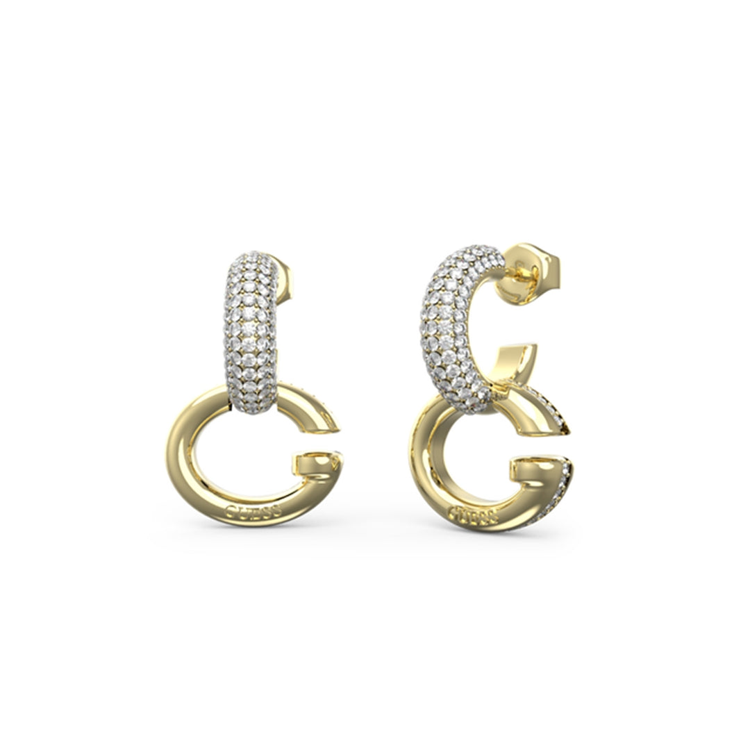 Gold-tone stud earrings shaped as letter G with pavé crystals and silver edge, on white background