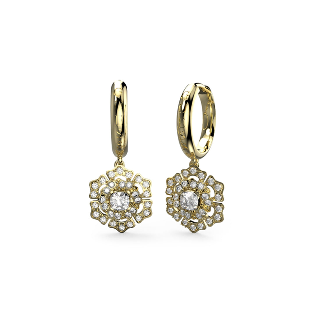 Gold-tone dangling floral earrings with white gemstones set in layered metal petals, shown on white background
