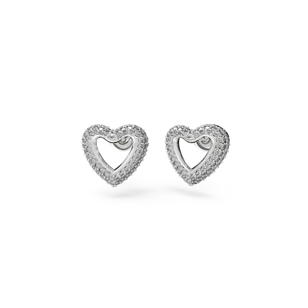 Silver heart stud earrings paved with small sparkling stones on polished metal background