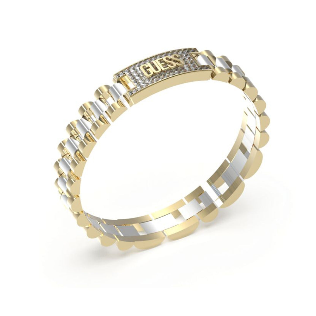Gold and silver chain bracelet with embedded crystals draped on a neutral background