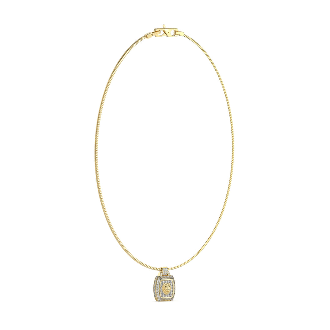 Two-tone gold and silver pendant necklace on fine chain with embedded stones and clasp closure, laid flat on neutral background