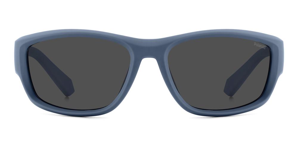 Blue plastic wrap-around sunglasses with black polarized lenses on white background, sporty profile