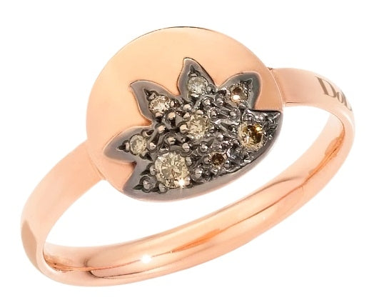Rose gold ring with clear diamonds and polished finish shown on neutral background
