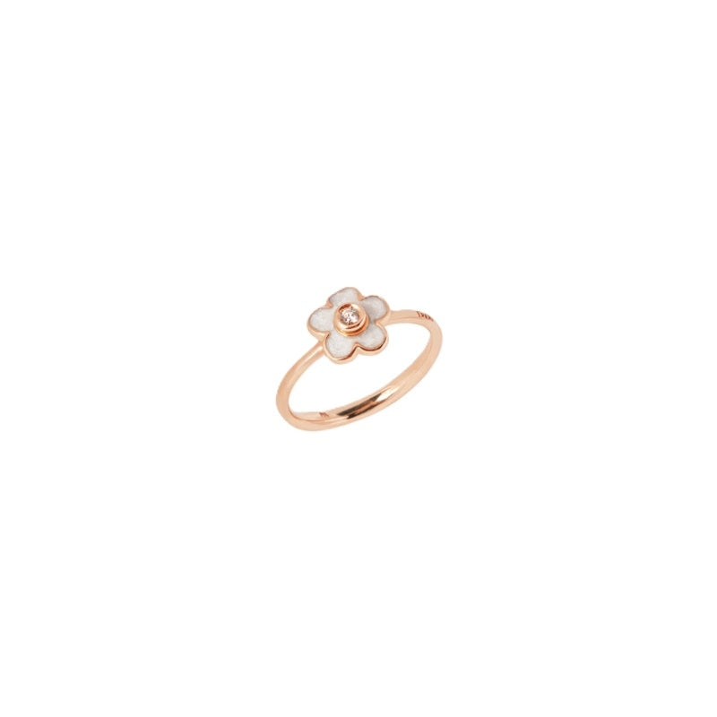Rose gold floral ring with white enamel petals and small diamond accent, polished finish