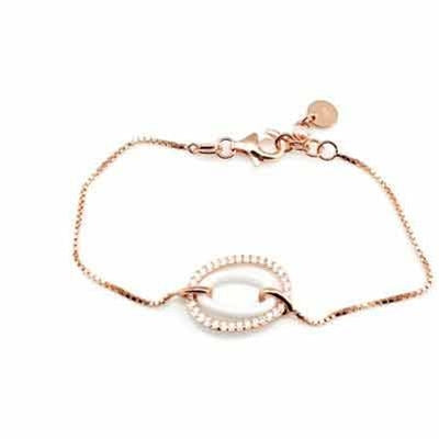 Delicate rose gold chain bracelet with oval pearl centerpiece and lobster clasp on white background